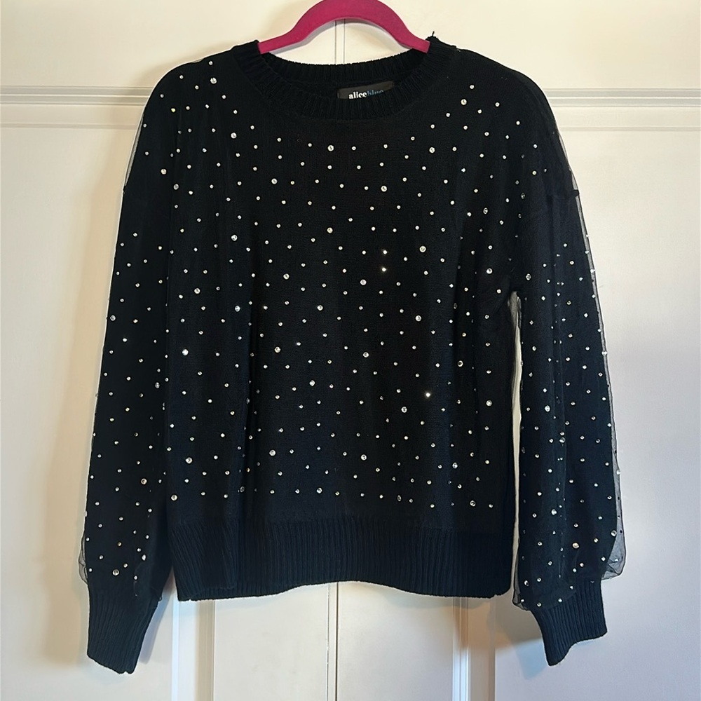 Women’s black sweater with rhinestone detail